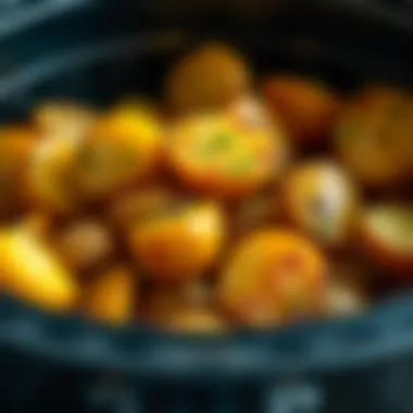 Seasoned Potatoes in Air Fryer A close-up view of seasoned potatoes in an air fryer basket