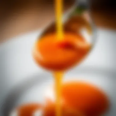 Caramel sauce cascading from a spoon