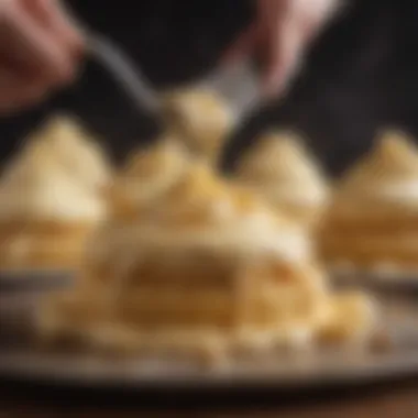 A close-up of pastry cream being piped onto a dessert, highlighting its smooth consistency.